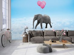 Fondtapet med himmel och moln och en elafant med ballonger som svävar